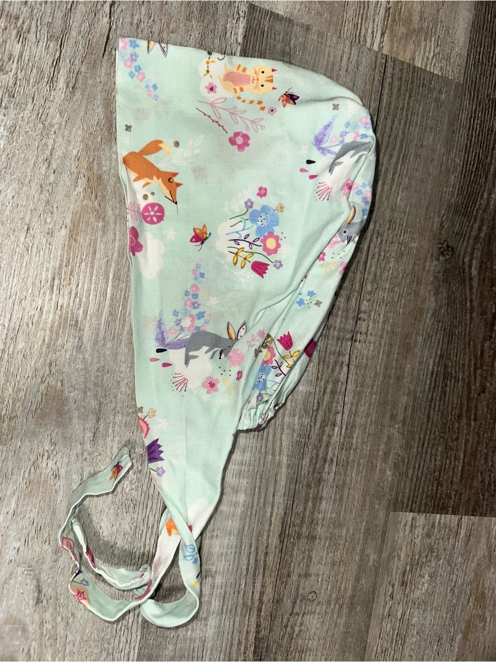 Springtime animals and florals tie-back surgical cap